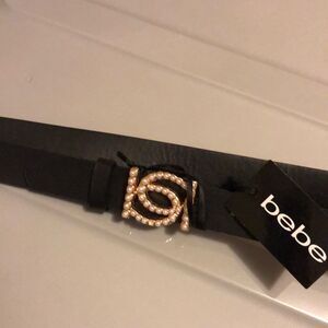 Bebe belt size medium black with gold tone buckle and pearl like NWT *flawed*